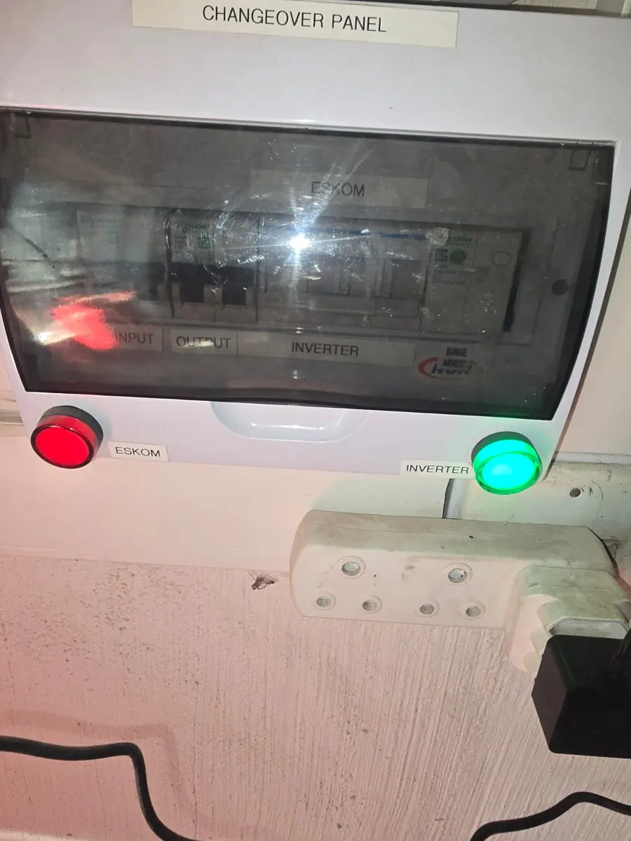 Changeover panel with red Eskom and green inverter indicator lamps