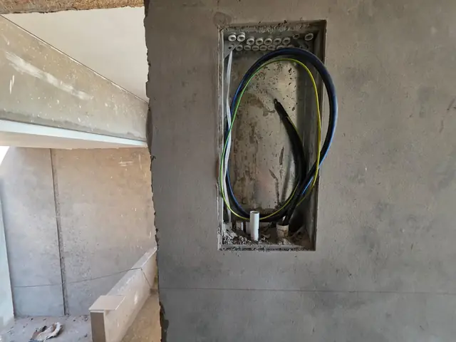 DB board recess with conduit and earth wiring ready for the board to be fitted