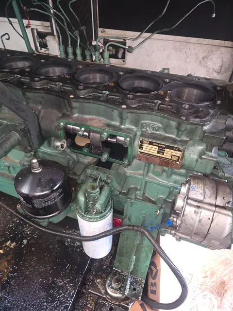 Diesel generator engine with the cylinder head removed during an overhaul
