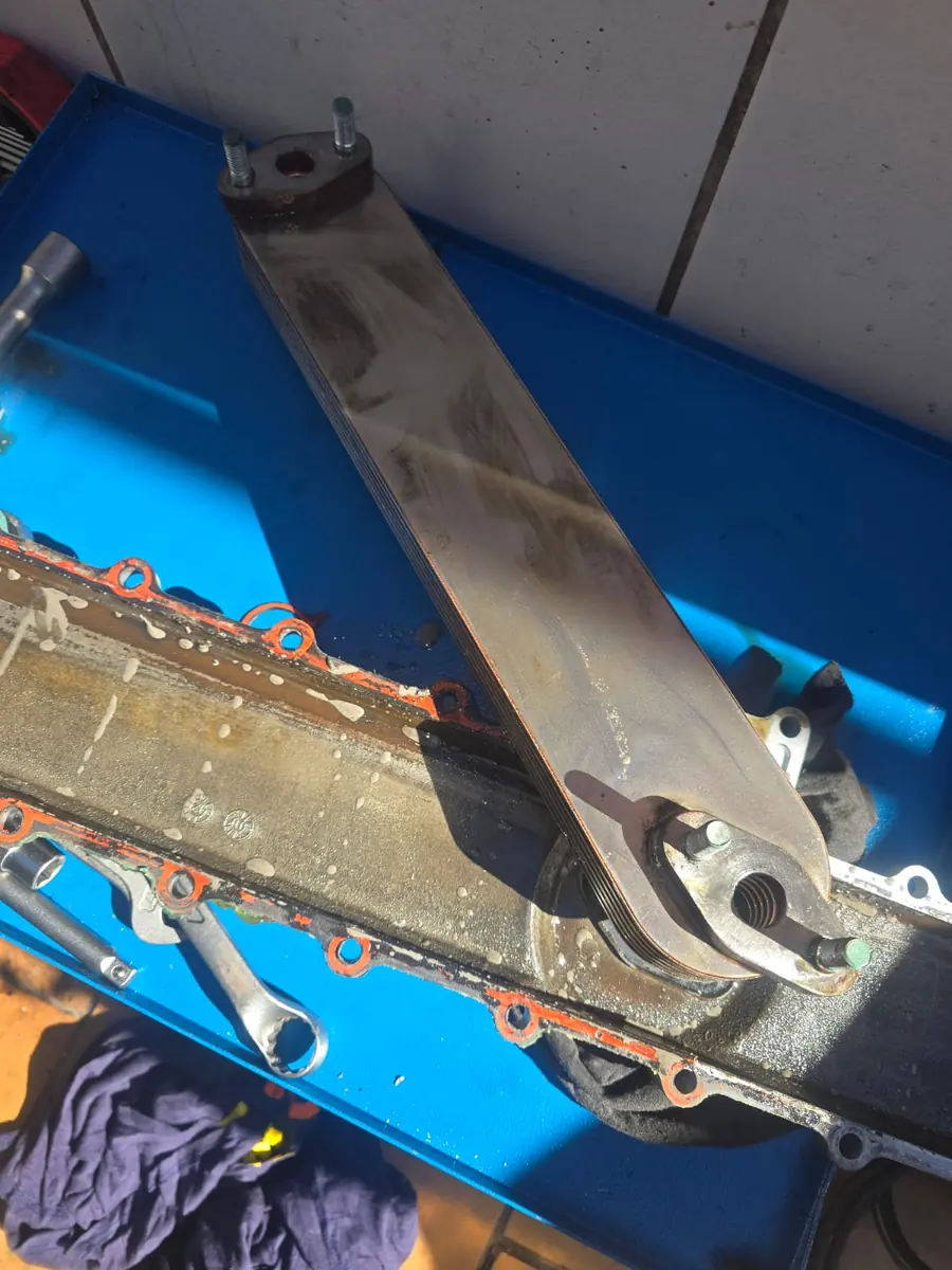 Generator oil cooler on the workshop bench during a repair