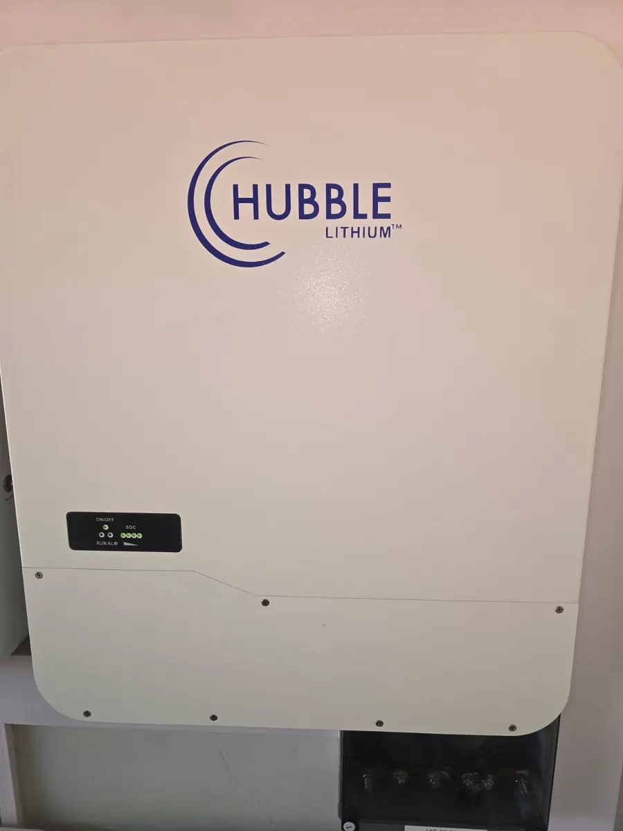 Wall-mounted Hubble lithium battery installed as part of a backup power system