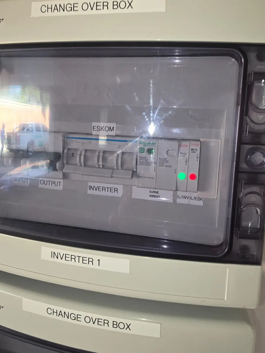 Change-over box for a hybrid inverter with Eskom and inverter input switches and surge arrestor