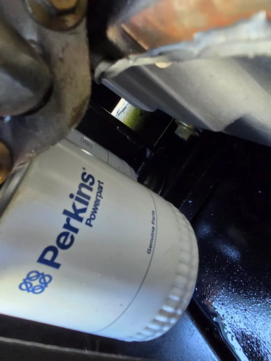 Genuine Perkins oil filter fitted during a generator service
