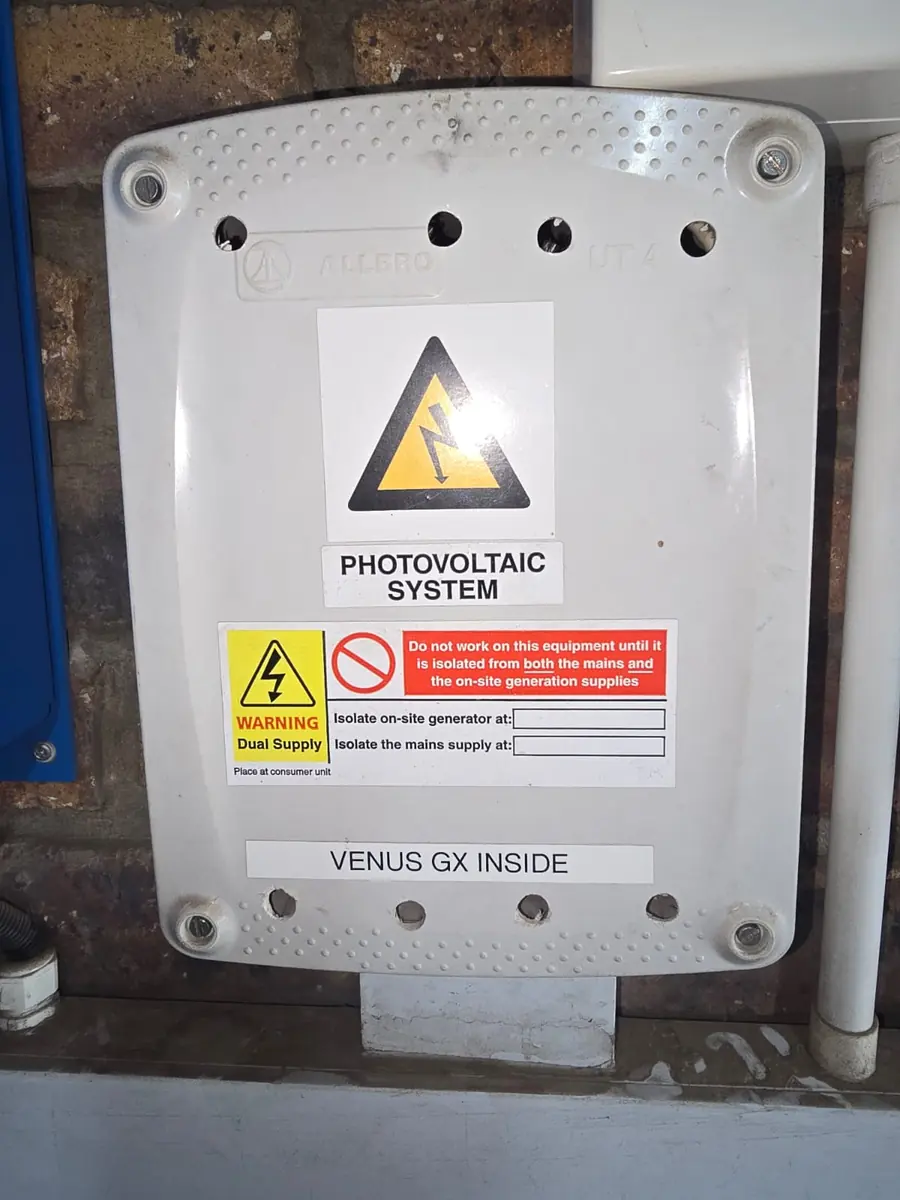 Victron Venus GX enclosure with photovoltaic system and dual-supply warning labels