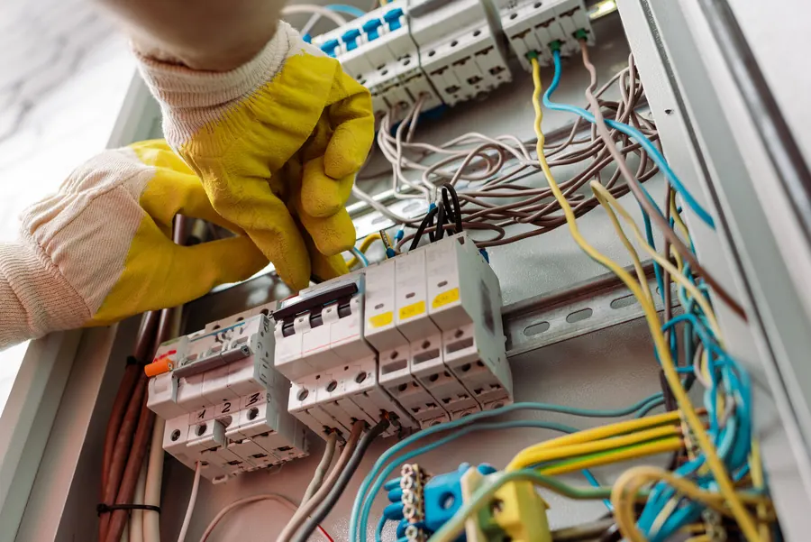 Electrician fixing an urgent electrical fault